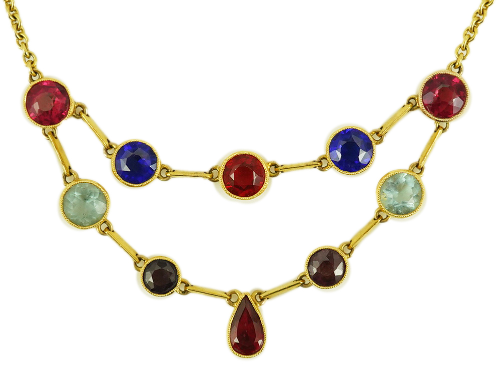 An early 20th century 15ct gold and ten stone multi coloured doublet set necklace